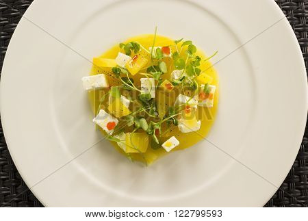 Golden beetroot cappachio with goat's cheese, baby watercress & smoked paprika oil