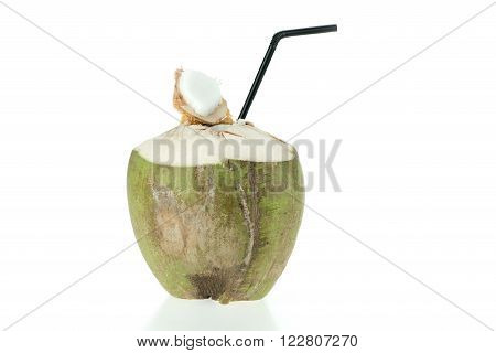 Opened green coconut with straw, isolated on white background. Food or fruit object concept