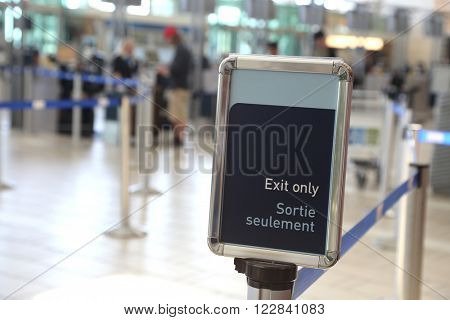 Vancouver, BC Canada - September 13, 2014 : Close up exit sign inside YVR airport in Vancouver BC Canada.