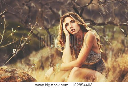 Fashion Lifestyle. Fashion Portrait of Beautiful Young Woman Outdoors. Soft warm vintage color tone. Artsy Bohemian Style.