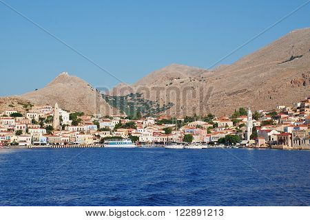 HALKI, GREECE - JUNE 17, 2015: Looking towards the village of Emborio on the Greek island of Halki. The Dodecanese island near Rhodes has a population of under 300 people.