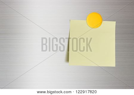 Blank note on a fridge door copy space for leaving several messages i.e. reminder plan lists memory orders sweet words sweet poems short notes to do lists info notice idea ad memo etc