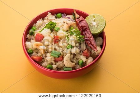 Rava Upma - Popular south Indian breakfast wiih semolina and vegetables, selective focus, Upma or upama is a South Indian breakfast, cooked from dry roasted semolina. seasonings of vegetables