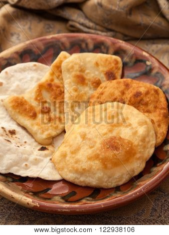 Food, Bakery. Some pastils on a plate, brown background