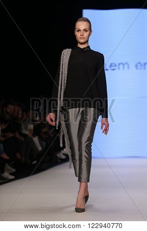 ISTANBUL, TURKEY - MARCH 18, 2016: A model showcases one of the latest creations of Ozlem Erkan in Mercedes-Benz Fashion Week Istanbul