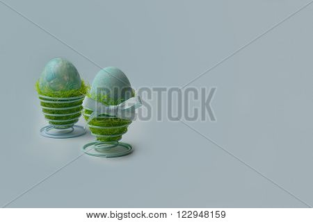 Easter decoration two turquoise eggs in egg holders