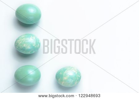 Easter decoration four turquoise eggs painted with acrylic paint