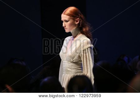 ISTANBUL TURKEY - MARCH 18 2016: A model showcases one of the latest creations of Derya Acikgoz in Mercedes-Benz Fashion Week Istanbul