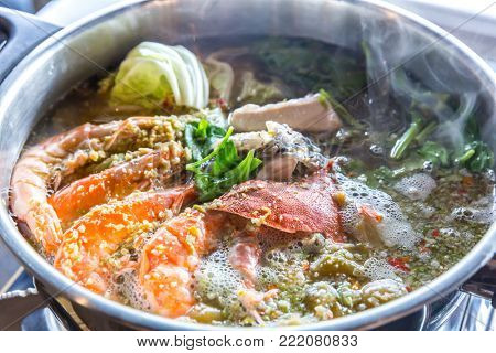 Seafood spicy hot pot crab prawn fish squid tumyum