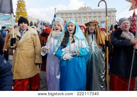 Kharkiv, Ukraine - January 13, 2018 - Participants traditional Christmas of Verteps Parade (nativity Scene), Christmas stars, carols singing. People wearing carnival clothes posing and smiling. Winter outdoor image.