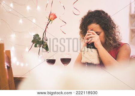 Portrait beautiful woman smile with a pink rose at restaurant on Valentines Day