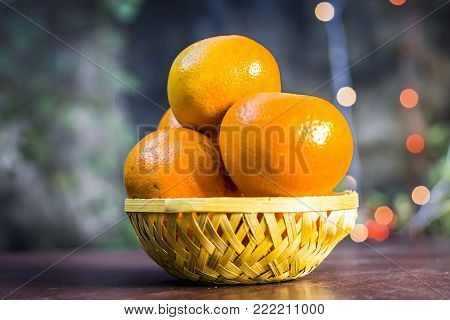 Close Up Of Fresh Ripe Oranges,citrus Aurantium In A Plate On Wooden Surface.