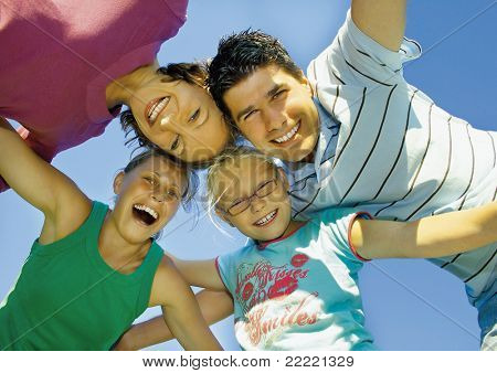 Young family is playing around on a sunny day. keyword for this collection is family7