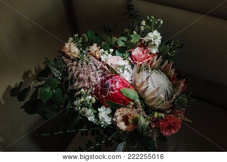 a bouquet of the bride in registration with roses and a proteus