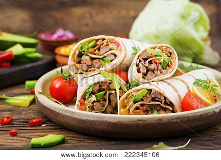 Burritos Wraps With Beef And Vegetables On A Wooden Background. Beef Burrito , Mexican Food. Healthy