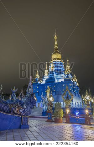 Pagoda at Rong Suar Ten temple with light in dark night sky