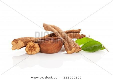 Banisteriopsis Caapi Wood, Psychotria Leaves And Ayahuasca Brew In Wooden Bowl Isolated On White Bac
