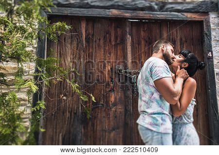 Couple hugging, newlyweds on honeymoon, relations happiness and affection. Guy and a girl kissing. Passionate kiss of a man and a woman. Lovers. Relationship between a man and a woman