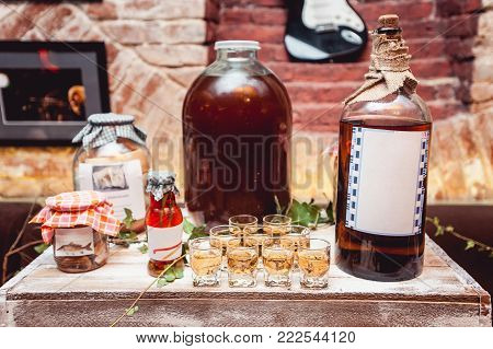 Many glass of hooch shots yellow and red, party set