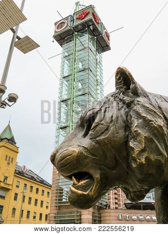 OSLO, NORWAY - JULY 27, 2013: Oslo Central Station. The Tiger, street sculpture and Trafikanten Tower, Ruter's Customer Service Centre. Landmark of Oslo, Norway capital