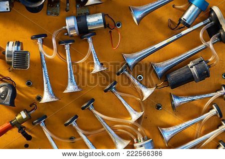Different vehicle horns are sold in an autoshop