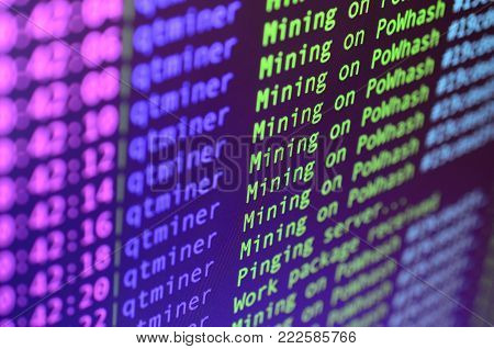 Macro snapshot of the program interface for crypto currency mining on the monitor of an office computer. The concept of mining bitcoins. The flow of information strings and data