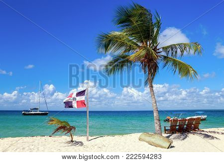 Saona island beach and Dominican Republic flag