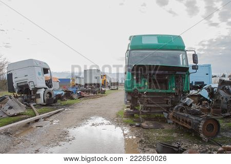 Abandon for years and old trucks rusts on a truck graveyard, worn out and rusty