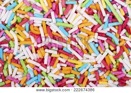 Colorful sugar sprinkle dots, decoration for cake and bakery, a lot of confectionery sprinkling