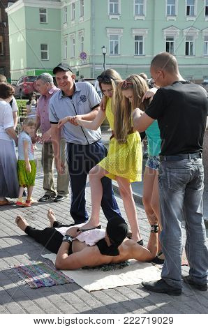 Tomsk, Russia, in summer day. Lenin Square. July 10, 2017. Men are showing tricks. People participating