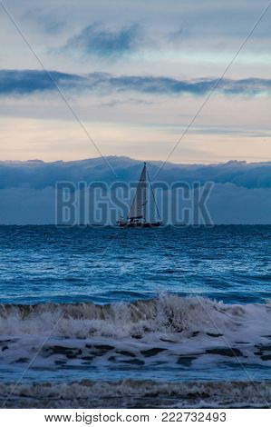 Ferryboat And Sailboat Cruising In Opposite Directions- Tynemouth, Uk