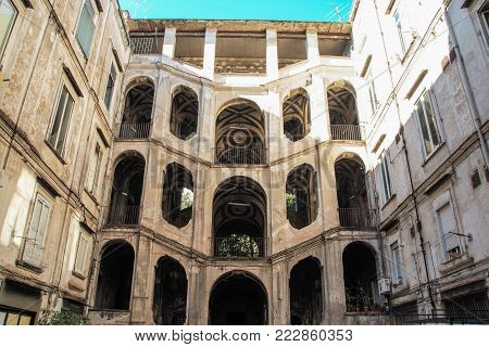 Laundry hanging in the courtryard of the  baroque palace Sanfelice  in Naples, Italy