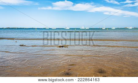 travel to France - view of on bay Anse de Launay from beach Plage de la Baie de Launay of English Channel in Paimpol region of Cotes-d'Armor department of Brittany in sunny summer day