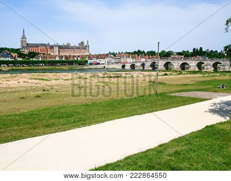 travel to France - view of Gien city from valley of Loire river in summer day