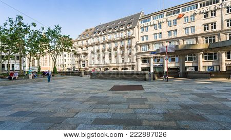 COLOGNE, GERMANY - JUNE 27, 2010: tourists on Domkloster square of Cologne Cathedral in summer day. The Cathedral is Germany's most visited landmark, attracting an average of 20000 people a day