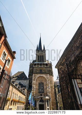 AACHEN, GERMANY - JUNE 27, 2010: West tower of Aachen Cathedral in summer. The Dom is one of the oldest cathedrals in Europe, it was constructed by emperor Charlemagne from 796