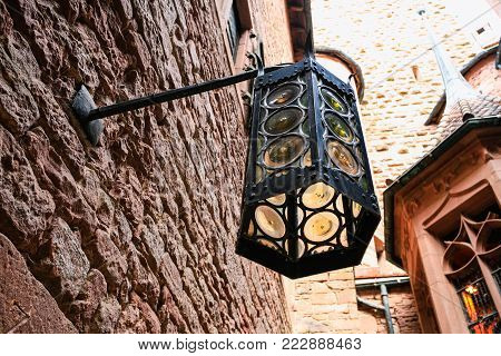 ORSCHWILLER, FRANCE - JULY 11, 2010: medieval lantern in castle Chateau du Haut-Koenigsbourg in Alsace. First time the castle was mentioned in 1147, the building was restored and rebuilt in 1900-1908