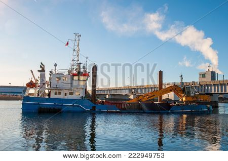 Vordingborg Denmark - January 7. 2018: Dredging and construction vessel Camilla Hoej preparing the underground for a new bridge