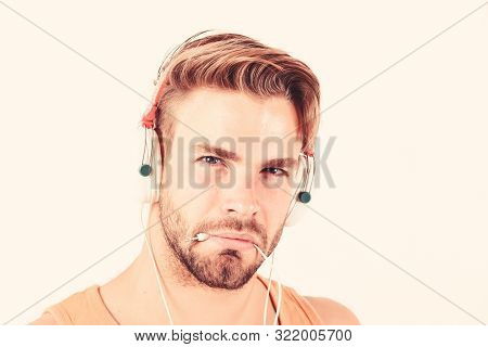 Sexy Muscular Man Listen Audio. Man In Earphones Isolated On White. E Book. Unshaven Man Listening A