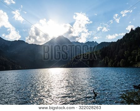 The Last Rays Of Sun On The Pond Of Sant Maurici, In The Aiguestortes And Sant Maurici National Park