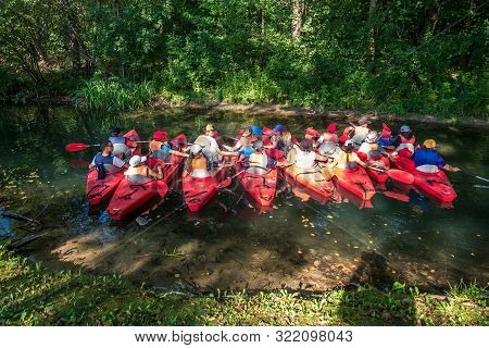Wigry, Poland -  August 2019: Many Kayaks With Children Stand On The Pier And Prepare For The Regatt