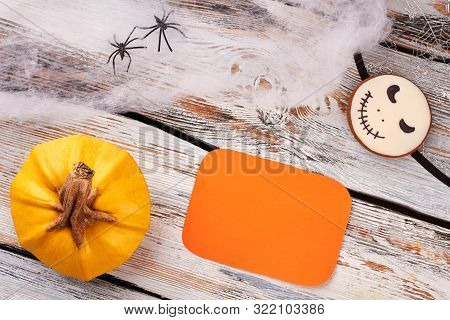 Halloween Holiday Background With Decorations. Flat Lay Pumpkin, Decorative Web, Spiders, Jack Skell