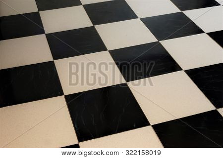 Floor Tiles-mosaic Background, Interior Design. The Black And White Square Tiles Of The Stone Floor 