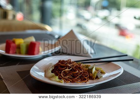 Chinese Fried Noodles And Chopsticks. Side Dish Of Celery And Carrots. Chinese Cabbage. Brown Chines