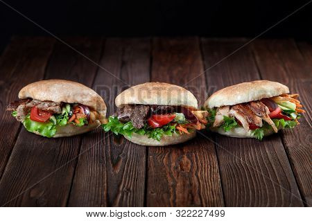 Close Up Of Kebab Sandwich On Wooden Background