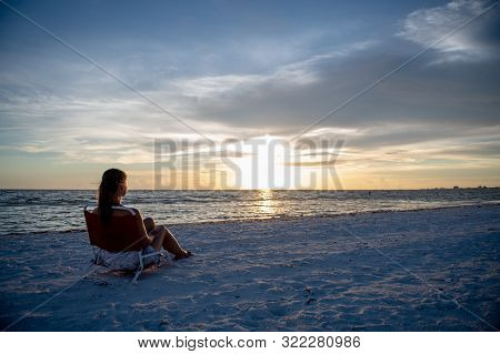 Young Woman And Sunset