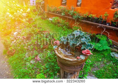 A Beautiful Small Decorative Fountain Made Of Porcelain Or Clay Molded In The Form Of Green Leaves A