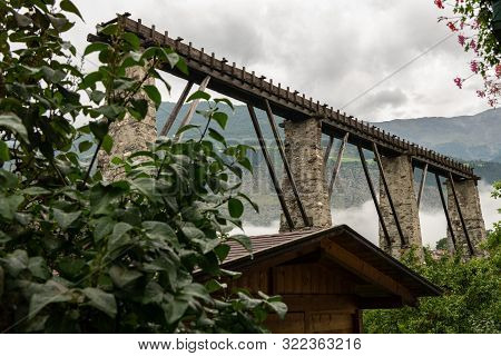 Remains Of The Old Aqueduct In Laas (south Tyrol, Italy) On A Cloudy Day In Summer