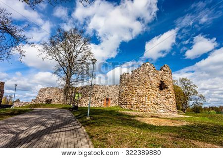 Ruins of Medieval Teutonic Knights Castle in Aluksne, Latvia. Sunny spring day.