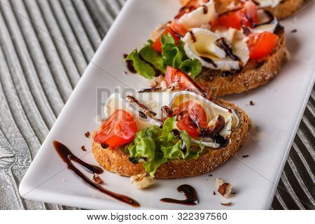 Bruschetta With Tomatoes, Lettuce, Camambert, Balsamic Vinegar